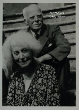 Photographs of an elderly man and woman seated on stairs.